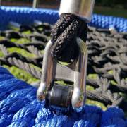 Steel shackle joining the rope to the nest swing rim