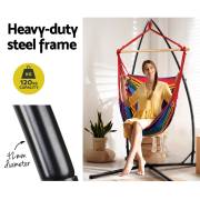 Heavy duty steel frame of the X stand, with a woman sitting in the rainbow chair