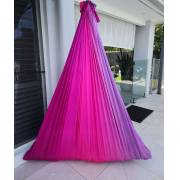 Pink purple tritone wrap swing hanging on a patio
