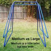 Medium swing set stand next to the large stand, the medium is a little taller but less wide