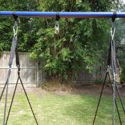 Swing set stand top bar with straps and carabiners fitted, no swing